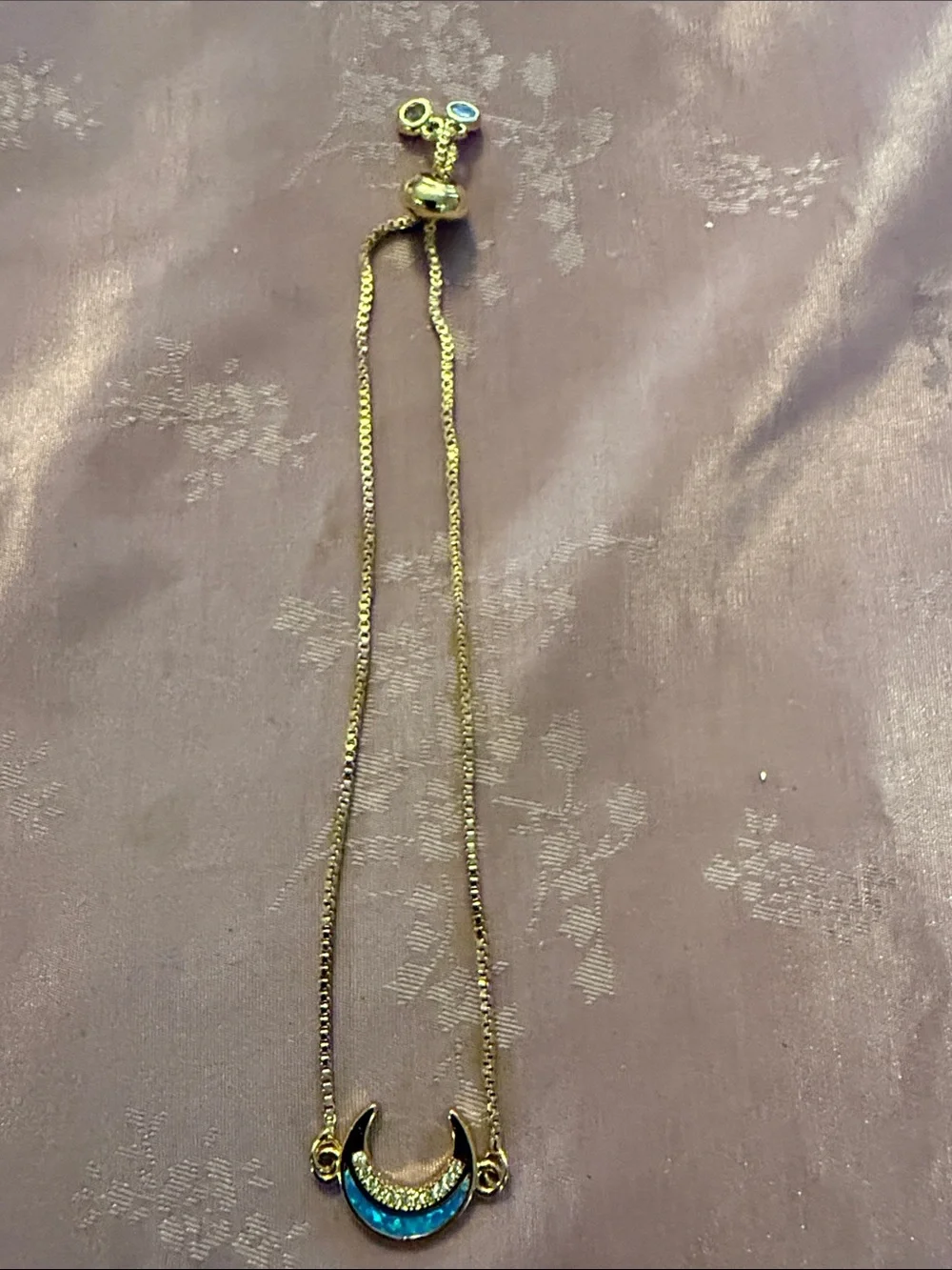 Gold Crescent bracelet with Blue Opal and Crystal Accents